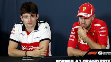 FILE PHOTO: Formula One F1 - Monaco Grand Prix - Circuit de Monaco, Monte-Carlo - May 23, 2018 Sauber&#039;s Charles Leclerc and Ferrari&#039;s Sebastian Vettel during a news conference ahead of the Monaco Grand Prix. REUTERS/Benoit Tessier/File Photo