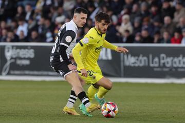 Villarreal's Adria Altimira and Juan Serrano of Unionistas in action on Sunday.
