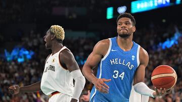 Greece's #34 Giannis Antetokounmpo (R) reacts after Germany's #0 Isaac Bonga (L) scored in the men's quarterfinal basketball match between Germany and Greece during the Paris 2024 Olympic Games at the Bercy Arena in Paris on August 6, 2024.