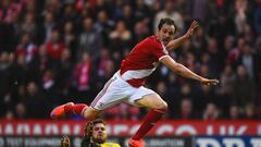 MIDDLESBROUGH, ENGLAND - MAY 15:  Harlee Dean of Brentford tackles Enrique Garcia Kike of Middlesbrough during the Sky Bet Championship Playoff semi final second leg match between Middlesbrough and Brentford at the Riverside Stadium on May 15, 2015 in Mid