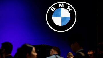 Visitors walk past a BMW logo at the Beijing International Automotive Exhibition, or Auto China 2024, in Beijing, China, April 25, 2024. REUTERS/Tingshu Wang