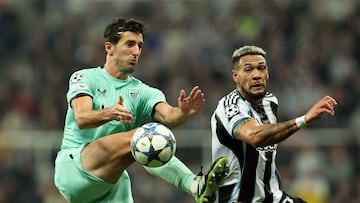 Soccer Football - UEFA Champions League - Newcastle United v Athletic Bilbao - St James' Park, Newcastle, Britain - November 5, 2025 Athletic Bilbao's Dani Vivian in action with Newcastle United's Joelinton REUTERS/Scott Heppell