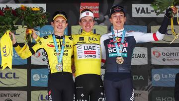 Second placed for the overall race Team Visma - Lease a Bike's Danish rider Jonas Vingegaard (L), first placed UAE Team Emirates XRG's Slovenian rider Tadej Poga?ar wearing the overall leader's yellow jersey and third placed Red Bull - BORA - hansgrohe's German rider Florian Lipowitz celebrate on the podium of the 8th and final stage of the 77th edition of the Criterium du Dauphine cycling race, 133,3 km between Val-d'Arc and Val-Cenis - Plateau du Mont Cenis, on June 15, 2025. (Photo by Anne-Christine POUJOULAT / AFP)
