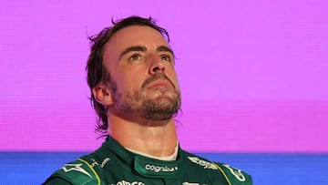 Aston Martin's Spanish driver Fernando Alonso reacts on the podium at the end of the Saudi Arabia Formula One Grand Prix at the Jeddah Corniche Circuit in Jeddah on March 19, 2023. (Photo by Giuseppe CACACE / AFP)