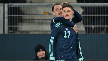 Germany's midfielder #17 Florian Wirtz celebrates scoring his team's third goal with Germany's defender #22 David Raum during the international friendly football match between Switzerland and Germany at St. Jakob-Park in Basel, Switzerland on March 27, 2026. (Photo by Fabrice COFFRINI / AFP)