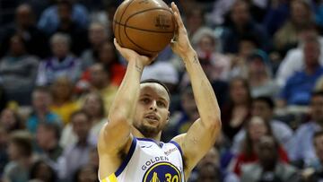 (FILES) In this file photo taken on February 25, 2019, Stephen Curry of the Golden State Warriors shoots during their game against the Charlotte Hornets at Spectrum Center in Charlotte, North Carolina. - Curry said on April 3, 2019, that a decision to start wearing contact lenses has helped him reverse a dip in his shooting numbers. Curry told The Athletic in an interview he had started wearing contact lenses to offset problems caused by a condition of the cornea called Keratoconus. (Photo by STREETER LECKA / GETTY IMAGES NORTH AMERICA / AFP)