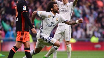 Real Madrid&#039;s Brazilian defender Marcelo (C) celebrates a goal during the Spanish league football match Real Madrid CF vs Valencia CF at the Santiago Bernabeu stadium in Madrid on April 29, 2017. / AFP PHOTO / PIERRE-PHILIPPE MARCOU