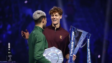Tennis - ATP Finals - Turin - Palasport Olimpico, Turin, Italy - November 16, 2025 Italy's Jannik Sinner celebrates with the trophy and runner up Spain's Carlos Alcaraz after winning the final REUTERS/Guglielmo Mangiapane