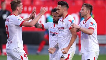 SEVILLE, SPAIN - APRIL 25: Lucas Ocampos of Sevilla FC celebrates after scoring their team's second goal with Suso, Luuk de Jong and Ivan Rakitic during the La Liga Santander match between Sevilla FC and Granada CF at Estadio Ramon Sanchez Pizjuan o