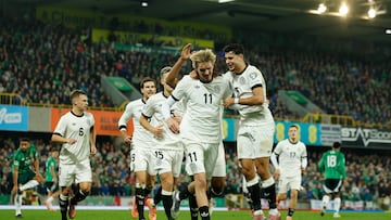 Soccer Football - FIFA World Cup - UEFA Qualifiers - Group A - Northern Ireland v Germany - Windsor Park, Belfast, Northern Ireland - October 13, 2025 Germany's Nick Woltemade celebrates scoring their first goal with Aleksandar Pavlovic REUTERS/Clodagh Kilcoyne