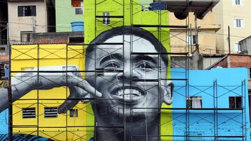 The image of Brazil&#039;s soccer player Gabriel Jesus is seen on the walls of houses in the neighbourhood he lived in during his childhood in Sao Paulo, Brazil May 16, 2018. REUTERS/Paulo Whitaker