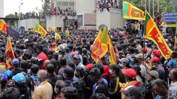 COLOMBO, SRI LANKA â JULY 9: Sri Lankan protestors demanding that President Gotabaya Rajapaksa steps down from the Presidency forcibly enter the Presidentâs House, the official residence of the President in Colombo, Sri Lanka, 09 July 2022. Months into the countryâs worst-ever economic crisis, thousands of protesters in Sri Lanka on Saturday stormed the presidentâs official residence and demanded his immediate resignation, local media reported. Holding Sri Lankan flags and helmets, some protesters broke through police barricades and entered President Gotabaya Rajapaksaâs residence in the capital Colombo, leading law enforcement to fire in the air to disperse them, according to video from local TV news channel NewsFirst. Local media claimed that Rajapaksa left the residence and was taken to a safe place. TV footage shows some of these protestors bursting through the gates of the presidential secretariat on the seafront, which has been the site of a sit-in protest for months. Prime Minister Ranil Wickremesinghe called an emergency meeting of political party leaders amid growing anger over the governmentâs handling of the economic crisis. (Photo by M.A. Pushpa Kumara/Anadolu Agency via Getty Images)