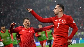 Turkey's forward #07 Kerem Akturkoglu (R) celebrates scoring his team's third goal with Turkey's forward #08 Arda Guler during the UEFA Euro 2024 Group F football match between Turkey and Georgia at the BVB Stadion in Dortmund on June 18, 2024. (Photo by INA FASSBENDER / AFP)