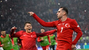 Turkey's forward #07 Kerem Akturkoglu (R) celebrates scoring his team's third goal with Turkey's forward #08 Arda Guler during the UEFA Euro 2024 Group F football match between Turkey and Georgia at the BVB Stadion in Dortmund on June 18, 2024. (Photo by INA FASSBENDER / AFP)