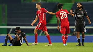 LISBON, PORTUGAL - AUGUST 19: Thomas Muller and Kingsley Coman of Bayern Munich interact with Jason Denayer of Olympique Lyonnais during the UEFA Champions League Semi Final match between Olympique Lyonnais and Bayern Munich at Estadio Jose Alvalade on Au