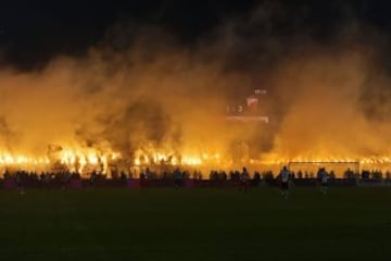 Partizan's supporters burn smoke grenades during the Serbian National soccer league derby match between Partizan and Red Star, in Belgrade on February 27, 2016. Red Star won 1-2 at the 150th edition of the 'Eternal Derby'. / AFP / ANDREJ ISAKOVIC