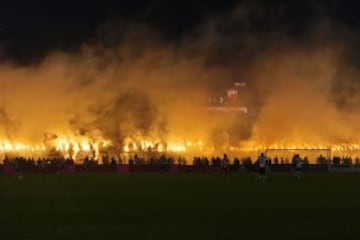 Partizan's supporters burn smoke grenades during the Serbian National soccer league derby match between Partizan and Red Star, in Belgrade on February 27, 2016. Red Star won 1-2 at the 150th edition of the 'Eternal Derby'.   / AFP / ANDREJ ISAKOVIC