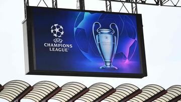 A giant screen displays the UEFA Champions League logo and trophy prior to the UEFA Champions League semi-final second leg football match between Inter Milan and AC Milan on May 16, 2023 at tyhe Giuseppe-Meazza (San Siro) stadium in Milan. (Photo by GABRIEL BOUYS / AFP)