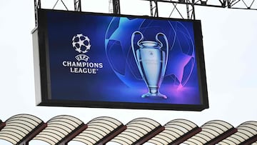 A giant screen displays the UEFA Champions League logo and trophy prior to the UEFA Champions League semi-final second leg football match between Inter Milan and AC Milan on May 16, 2023 at tyhe Giuseppe-Meazza (San Siro) stadium in Milan. (Photo by GABRIEL BOUYS / AFP)