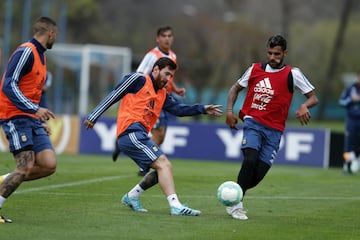 Leo Messi y Augusto Fernández.