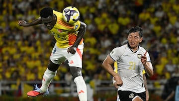 Colombia's defender #23 Davinson Sanchez and Bolivia's defender #21 Jose Sagredo fight for the ball during the 2026 FIFA World Cup South American qualifiers football match between Colombia and Bolivia at the Roberto Melendez Metropolitan stadium in Barranquilla, Colombia on September 4, 2025. (Photo by Luis ACOSTA / AFP) (Photo by LUIS ACOSTA/AFP via Getty Images)