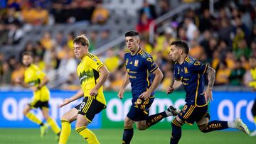  Aidan Morris (L) of Columbus fights for the ball with Juan Brunetta and Fernando Gorriaran (R) of Tigres  during the quarterfinals first  leg match between Columbus Crew and UANL  as part of the CONCACAF Champions Cup 2024, at Lower.com Stadium on April 02, 2024 in Columbus, Ohio, United States.