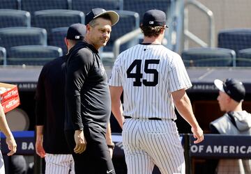 NEW YORK, NEW YORK - MAY 21: Manager Aaron Boone #17 of the New York Yankees greets Gerrit Cole #45 after Cole threw from the mound before a game against the Seattle Mariners at Yankee Stadium on May 21, 2024 in New York City.   Jim McIsaac/Getty Images/AFP (Photo by Jim McIsaac / GETTY IMAGES NORTH AMERICA / Getty Images via AFP)