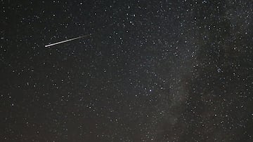 A meteor dashes above Tvrtkovac mountain during the Perseid meteor shower seen from Zenica, Bosnia and Herzegovina, August 8, 2021.  REUTERS/Dado Ruvic