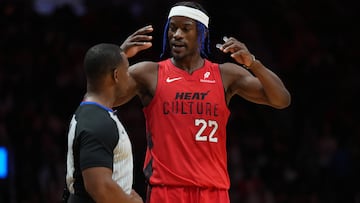 Dec 7, 2024; Miami, Florida, USA; Miami Heat forward Jimmy Butler (22) talks with official Dedric Taylor during a timeout in the second half against the Phoenix Suns at Kaseya Center. Mandatory Credit: Jim Rassol-Imagn Images