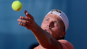 France�s Alexandre Muller serves to France's Ugo Humbert during their 2025 ATP Tour Madrid Open tennis tournament third round singles match at the Caja Magica in Madrid, on April 26, 2025. (Photo by Thomas COEX / AFP)