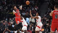 Oct 25, 2021; Toronto, Ontario, CAN; Chicago Bulls guard Lonzo Ball (2) passes the ball away from Toronto Raptors forward Scottie Barnes (4) in the first half at Scotiabank Arena. Mandatory Credit: Dan Hamilton-USA TODAY Sports