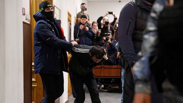 Shamsidin Fariduni, a suspect in the shooting attack at the Crocus City Hall concert venue, is escorted before a court hearing at the Basmanny district court in Moscow, Russia March 25, 2024. REUTERS/Yulia Morozova