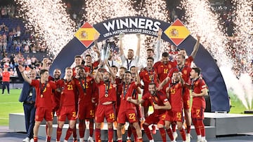 Spain's celebrate on the podium with the UEFA Nations League cup after winning the penalty shootouts and the UEFA Nations League final football match between Croatia and Spain at the De Kuip Stadium in Rotterdam on June 18, 2023. (Photo by JOHN THYS / AFP)