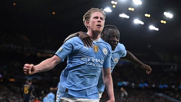 Manchester City's Belgian midfielder #17 Kevin De Bruyne celebrates after scoring his team first and equalising goal during the UEFA Champions League quarter-final second-leg football match between Manchester City and Real Madrid, at the Etihad Stadium, in Manchester, north-west England, on April 17, 2024. (Photo by Paul ELLIS / AFP)