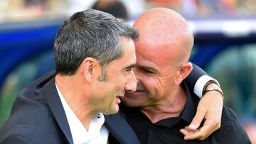 Barcelona's Spanish coach Ernesto Valverde (L) and Levante's Spanish coach Paco Lopez greet each other before the Spanish League football match between Levante UD and FC Barcelona at the Ciutat de Valencia stadium in Valencia, on November 2, 201