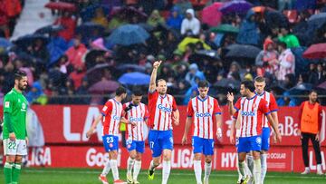 Girona's Ukrainian forward #09 Artem Dovbyk (R) celebrates after scoring his team's second goal during the Spanish league football match between Girona FC and Real Betis at the Montilivi stadium in Girona on March 31, 2024. (Photo by PAU BARRENA / AFP)