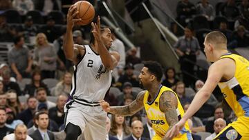 Jan 13, 2018; San Antonio, TX, USA; San Antonio Spurs small forward Kawhi Leonard (2) passes the ball against Denver Nuggets small forward Wilson Chandler (21) during the first half at AT&amp;T Center. Mandatory Credit: Soobum Im-USA TODAY Sports