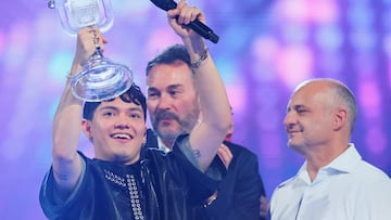 JJ, representing Austria, winner of the 2025 Eurovision Song Contest, holds the trophy during the Grand Final, in Basel, Switzerland, May 18, 2025. REUTERS/Denis Balibouse