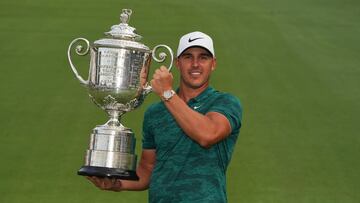 ST. LOUIS, MO - August 12: Brooks Koepka poses with the Wanamaker Trophy after winning the 100th PGA Championship held at Bellerive Golf Club on August 12, 2018 in St. Louis, Missouri. (Photo by Montana Pritchard/PGA of America via Getty Images)