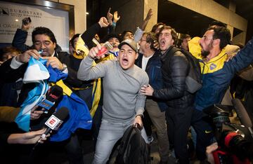 Boca Juniors fans await the team's arrival in Madrid.