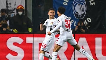 Leverkusen's Chilean midfielder Charles Aranguiz (C) celebrates with Leverkusen's French forward Amine Adli after opening the scoring during the UEFA Europa League round of 16, 1st leg football match between Atalanta and Leverkusen on March 10, 2022 at the Azzurri d'Italia stadium in Bergamo. (Photo by MIGUEL MEDINA / AFP) (Photo by MIGUEL MEDINA/AFP via Getty Images)