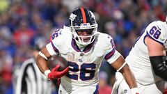 Oct 15, 2023; Orchard Park, New York, USA; New York Giants running back Saquon Barkley (26) carries the ball against the Buffalo Bills in the fourth quarter at Highmark Stadium. Mandatory Credit: Mark Konezny-USA TODAY Sports