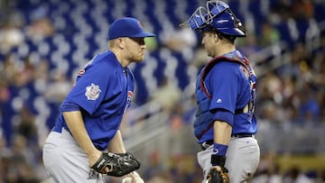 Chicago Cubs starting pitcher Mike Montgomery, left, talks with catcher Miguel Montero during the first inning of a baseball game against the Miami Marlins, Sunday, June 25, 2017, in Miami. (AP Photo/Lynne Sladky)