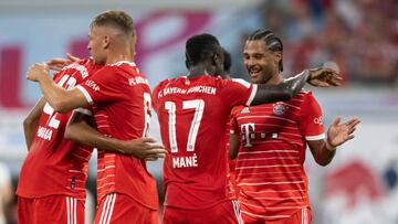 30 July 2022, Saxony, Leipzig: Soccer: DFL Supercup, RB Leipzig - Bayern Munich, Red Bull Arena. Bayern's Sadio Mane (2nd from right) celebrates his goal to make it 0:2 with Serge Gnabry (r). Photo: Hendrik Schmidt/dpa - IMPORTANT NOTE: In accordance with the requirements of the DFL Deutsche Fußball Liga and the DFB Deutscher Fußball-Bund, it is prohibited to use or have used photographs taken in the stadium and/or of the match in the form of sequence pictures and/or video-like photo series. (Photo by Hendrik Schmidt/picture alliance via Getty Images)