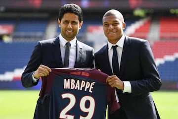 Paris Saint-Germain's new forward Kylian Mbappe (R) together with Paris Saint Germain's Qatari president Nasser Al-Khelaifi.