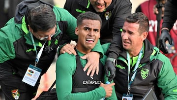 Bolivia's forward Enzo Monteiro (C) celebrates with Bolivian team members after scoring during the 2026 FIFA World Cup South American