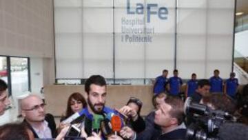 Álvaro Negredo habla con los medios tras la visita de los jugadores del Valencia a los niños ingresados en el Hospital La Fe de la ciudad valenciana.