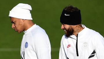 Paris Saint-Germain&#039;s French forward Kylian Mbappe (L) and Paris Saint-Germain&#039;s Brazilian forward Neymar react during a training session at Saint-Germain-en-Laye, on December 10, 2019 on the eve of the UEFA Champions League Group A football mat