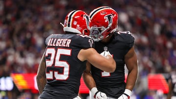 Oct 13, 2025; Atlanta, Georgia, USA; Atlanta Falcons running back Tyler Allgeier (25) reacts with running back Bijan Robinson (7) after scoring a touchdown against the Buffalo Bills during the first half of a game at Mercedes-Benz Stadium. Mandatory Credit: Brett Davis-Imagn Images
