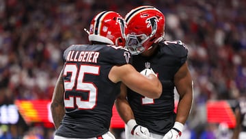 Oct 13, 2025; Atlanta, Georgia, USA; Atlanta Falcons running back Tyler Allgeier (25) reacts with running back Bijan Robinson (7) after scoring a touchdown against the Buffalo Bills during the first half of a game at Mercedes-Benz Stadium. Mandatory Credit: Brett Davis-Imagn Images